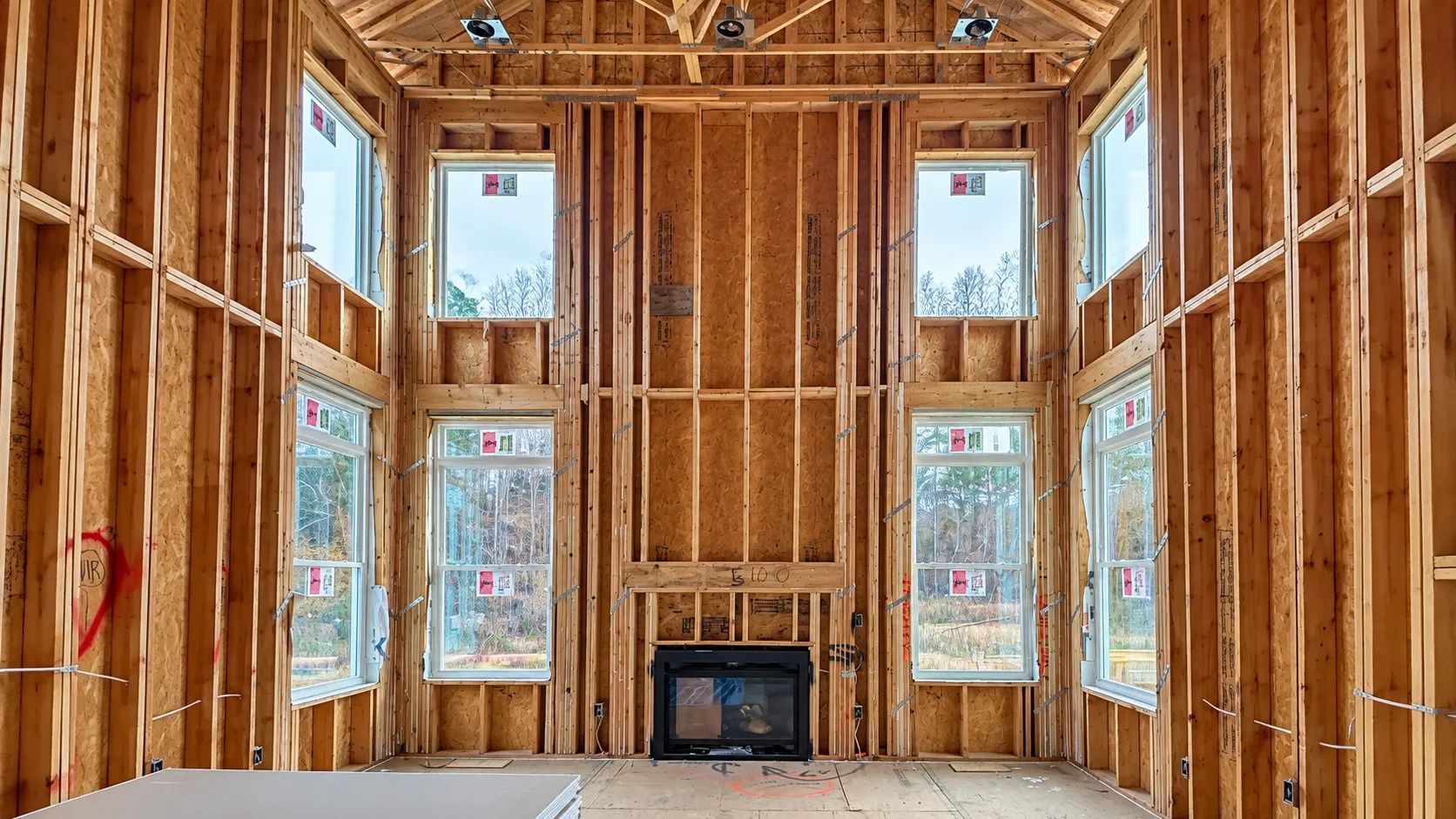 Plumbing, electrical, and HVAC rough-ins before drywall